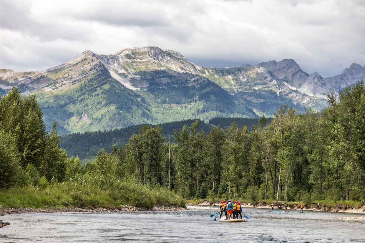 Floating down the Elk River in Fernie on a giant inflatable SUPSquatch