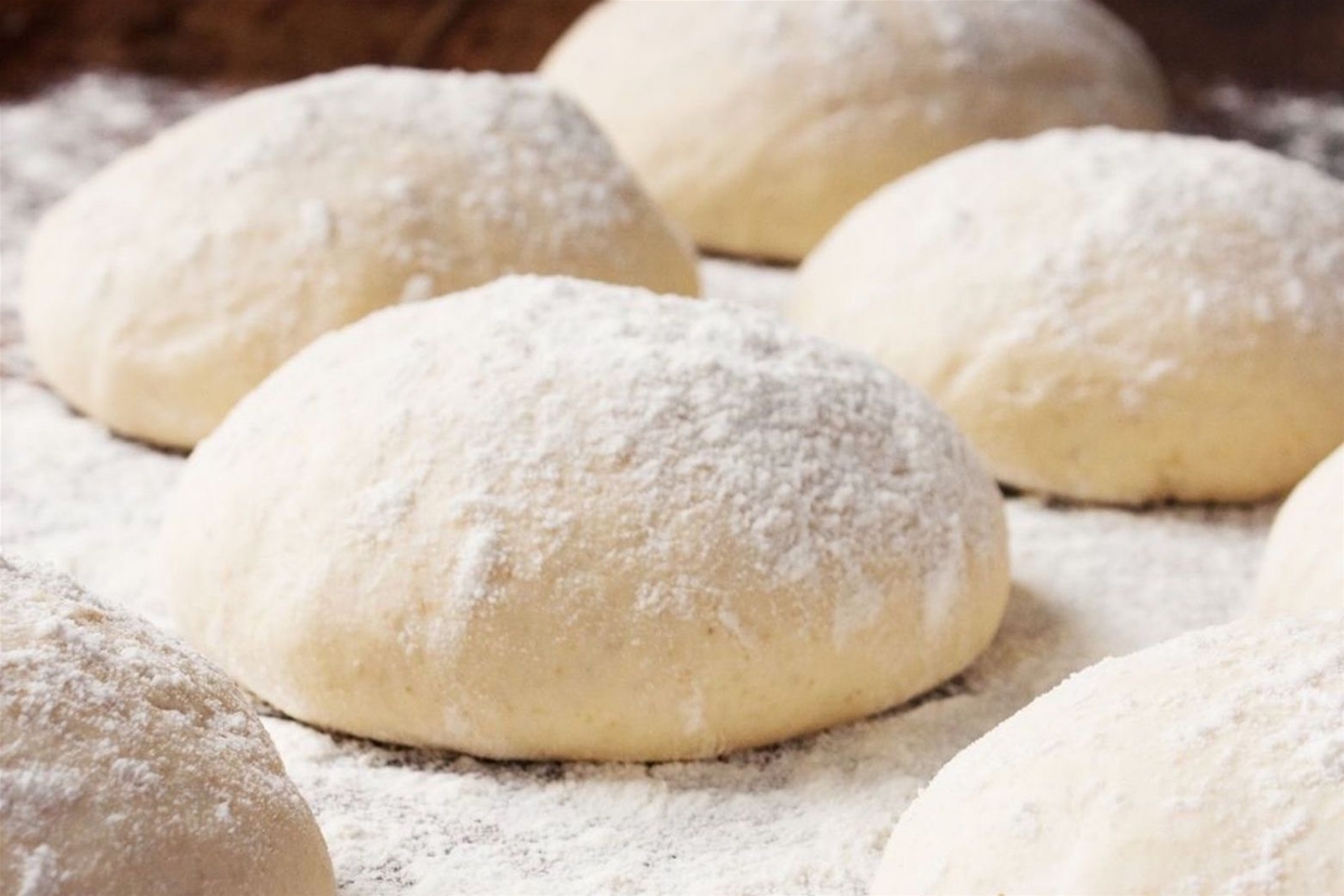 Pizza dough prepared fresh in house daily